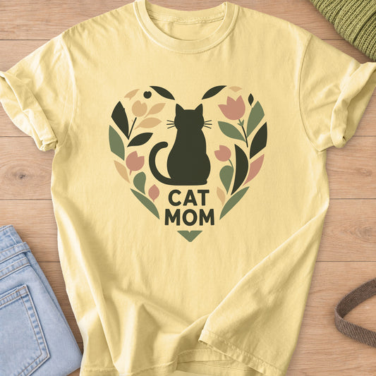 Sitting cat silhouette inside a heart wreath of leaves and tulips, "Cat Mom" on a Butter T-Shirt