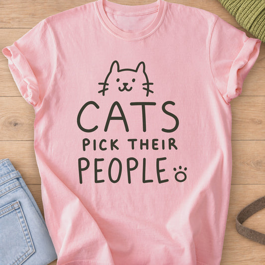Simple cat face peeking over the words "Cats pick their people" and a paw print, dark charcoal ink on a Blossom T-Shirt