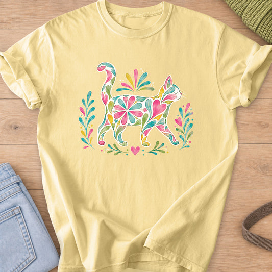 Walking cat silhouette filled with flowers, hearts and leaves between leafy sprigs on a Butter T-Shirt