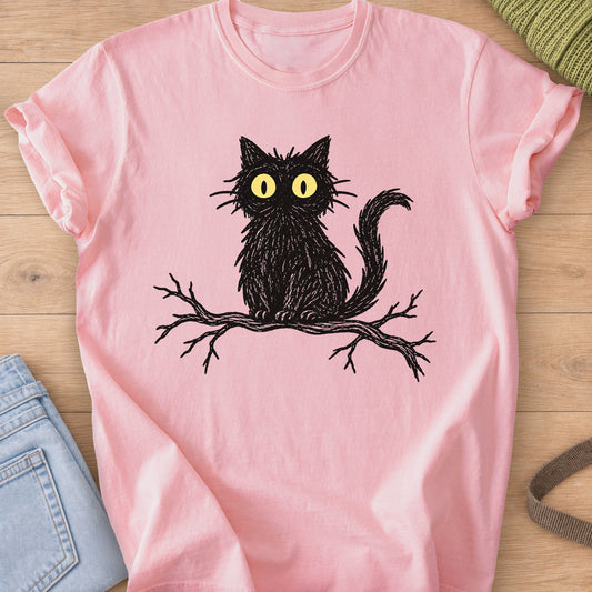 Fluffy cat with wide staring eyes sitting on a bare tree branch, black and yellow ink on a Blossom T-Shirt