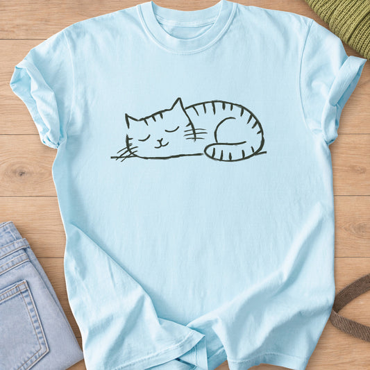 Striped tabby cat curled up asleep with closed eyes and a small smile, dark charcoal ink on a Chambray T-Shirt