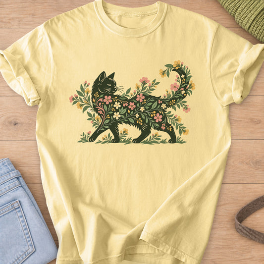 Walking cat silhouette filled with blooming flowers and leafy vines, tail curled up on a Butter T-Shirt