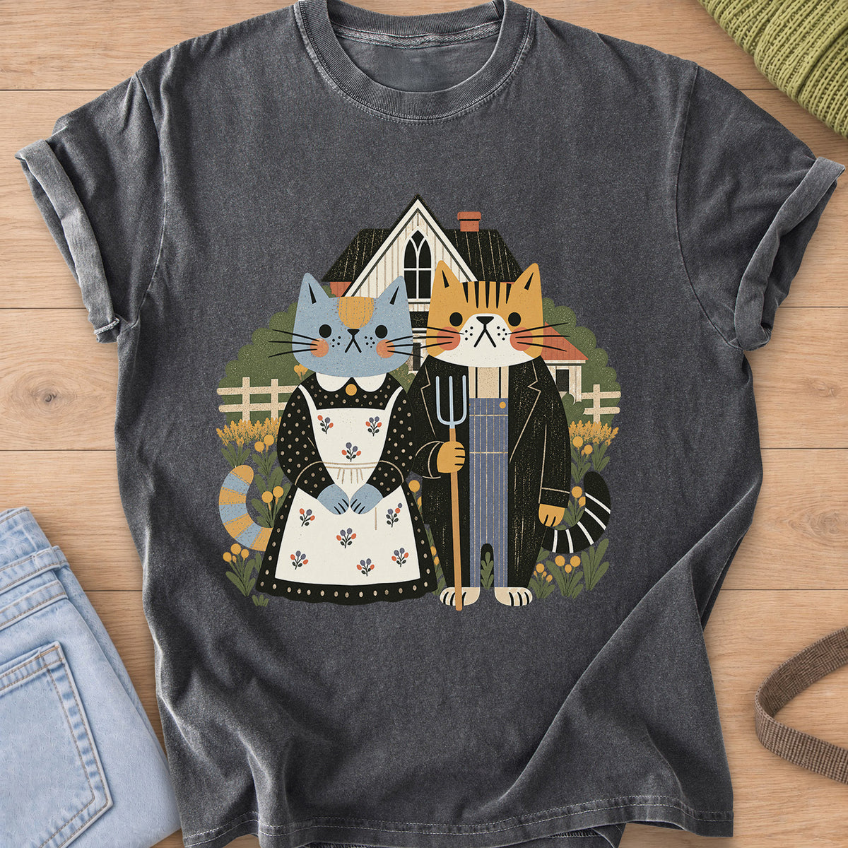Two cats posed as American Gothic with pitchfork, apron, farmhouse and flowers on a Pepper T-Shirt