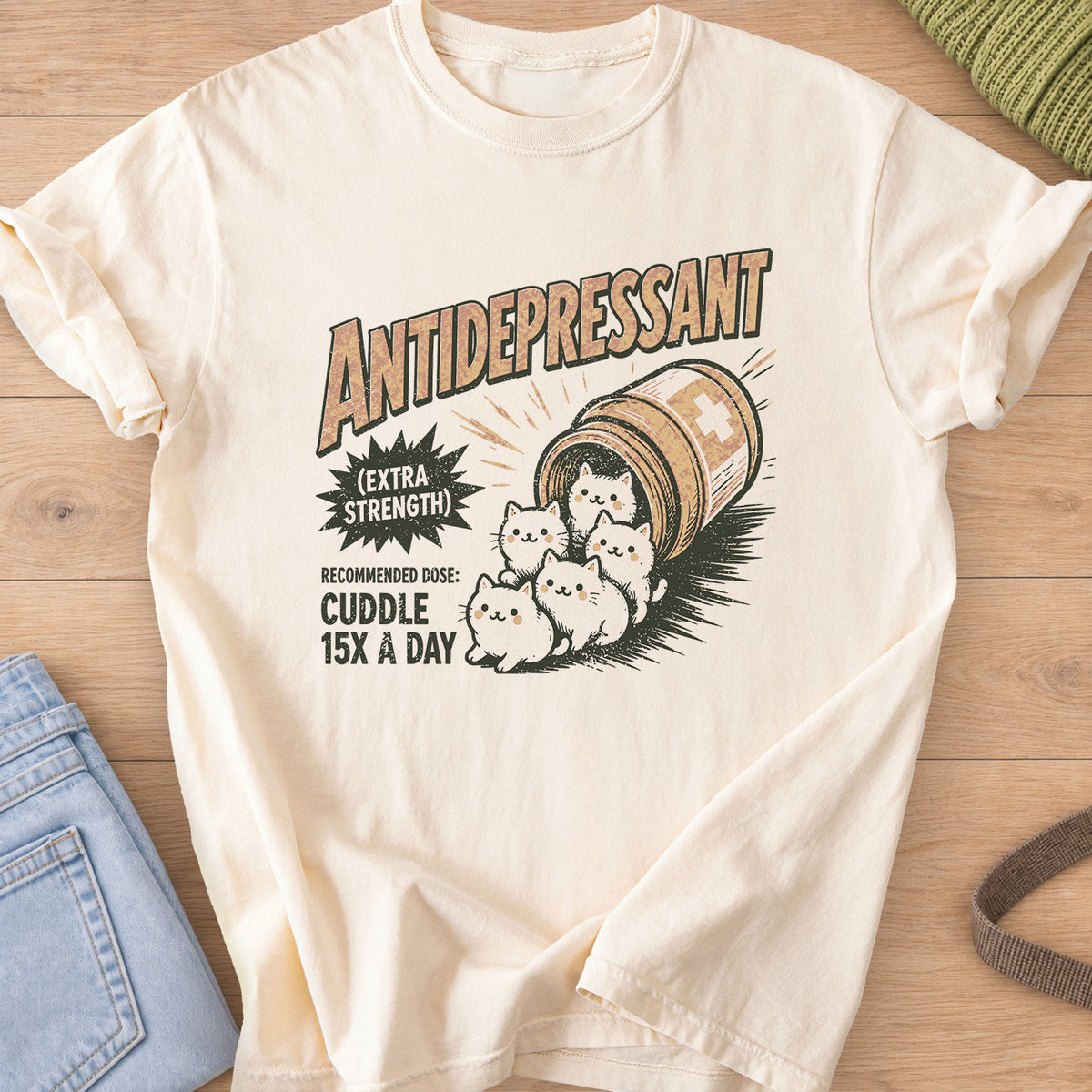 Five kittens tumbling out of a tipped pill bottle, "Cuddle 15X a day" on an Ivory T-Shirt