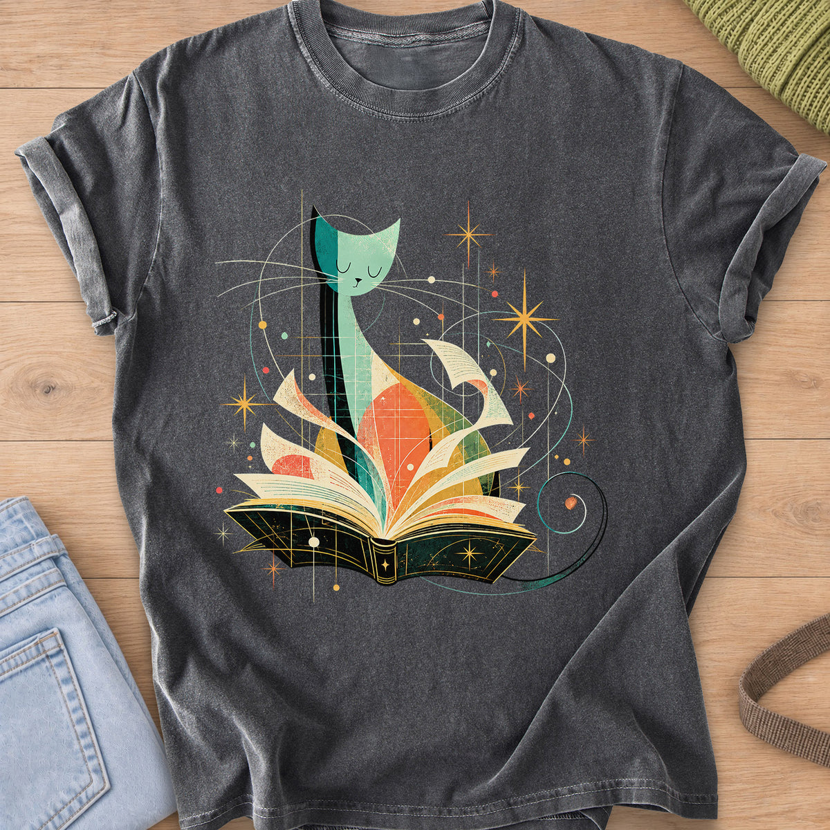 Tall slender cat with closed eyes behind an open book, flying pages and stars on a Pepper T-Shirt