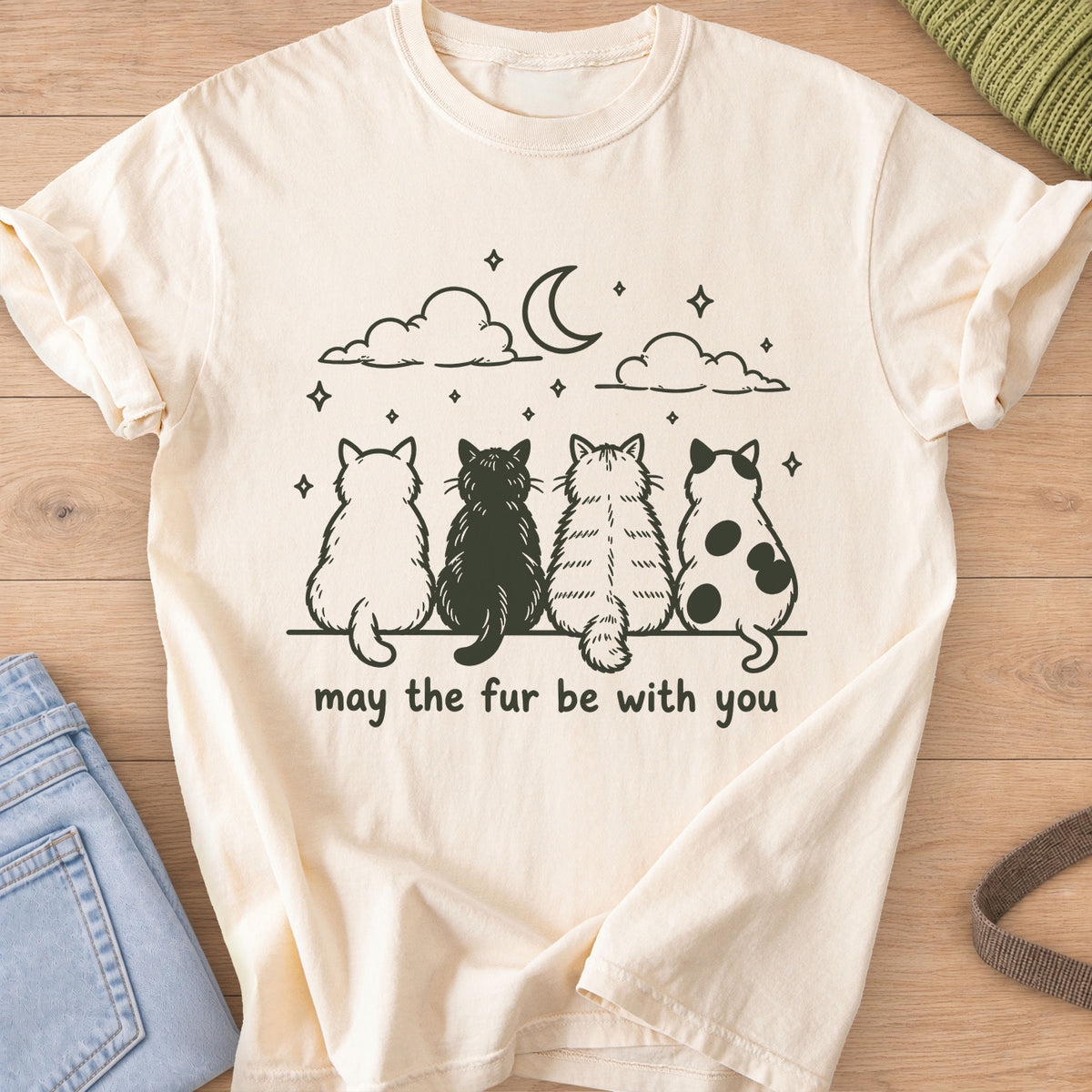 Four cats from behind gaze at a crescent moon and stars, "may the fur be with you", dark charcoal ink on an Ivory T-Shirt