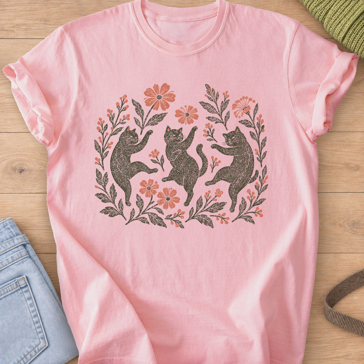 Three cats dancing on their hind legs among flowers, leafy stems and berries, charcoal and coral ink on a Blossom T-Shirt