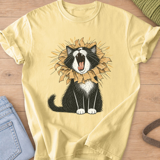 Tuxedo cat roaring with a torn paper bag mane like a lion, sunburst rays behind on a Butter T-Shirt