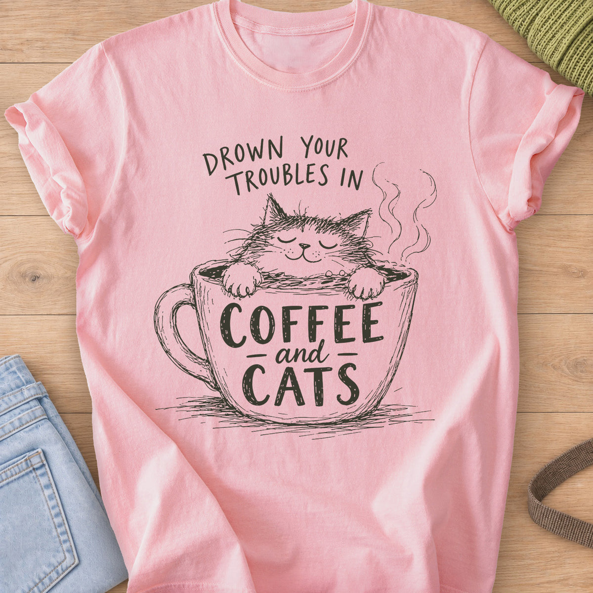 Scruffy cat with closed eyes soaking in a steaming mug that reads "Coffee and Cats", dark charcoal ink on a Blossom T-Shirt