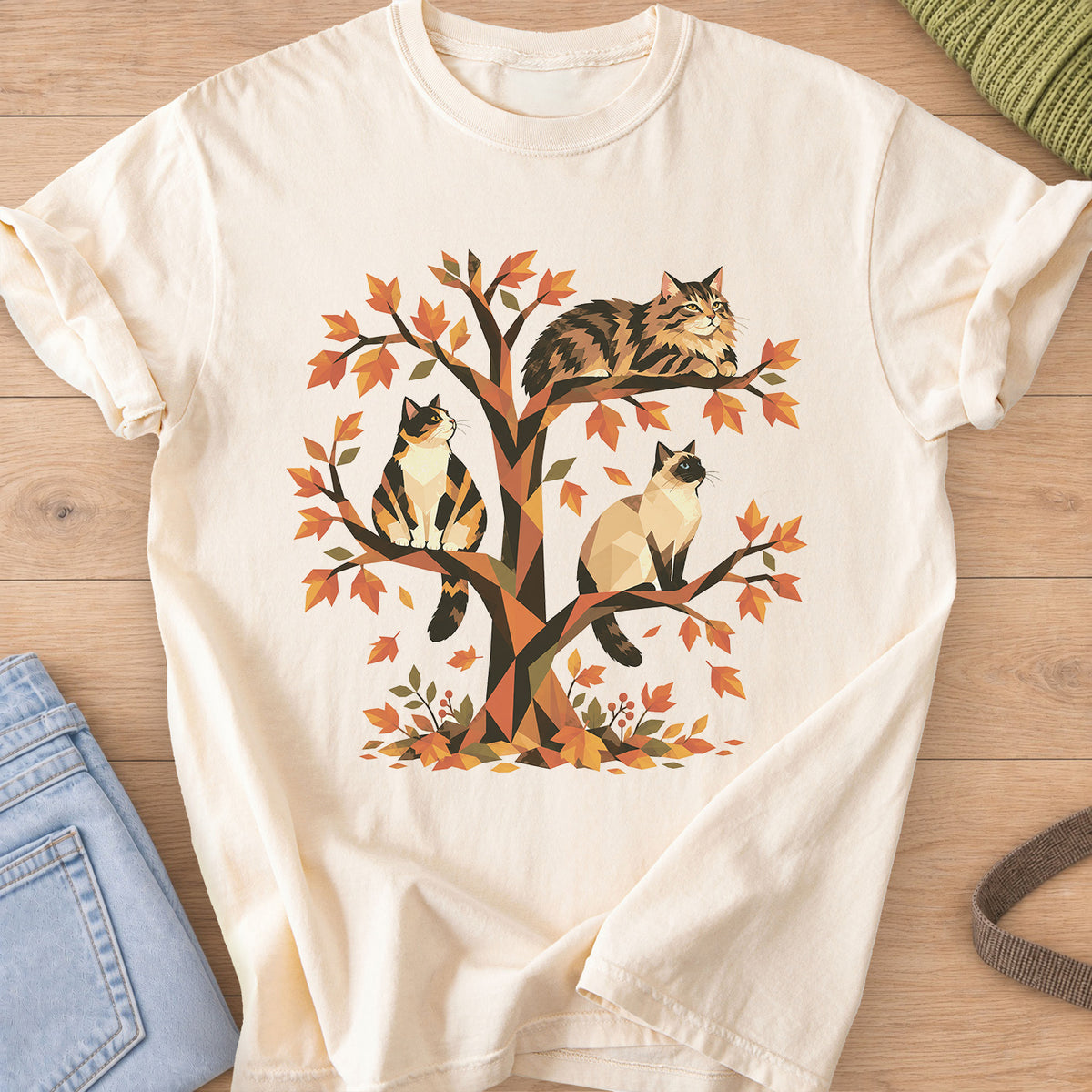 Calico, tabby and Siamese cats perched in a geometric autumn tree with leaves on an Ivory T-Shirt
