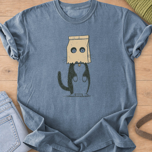 Cat standing on hind legs with a paper bag on its head, eyes peering through holes on a Blue Jean T-Shirt