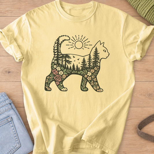 Walking cat silhouette filled with pine forest, birds, wildflowers and a sun above on a Butter T-Shirt