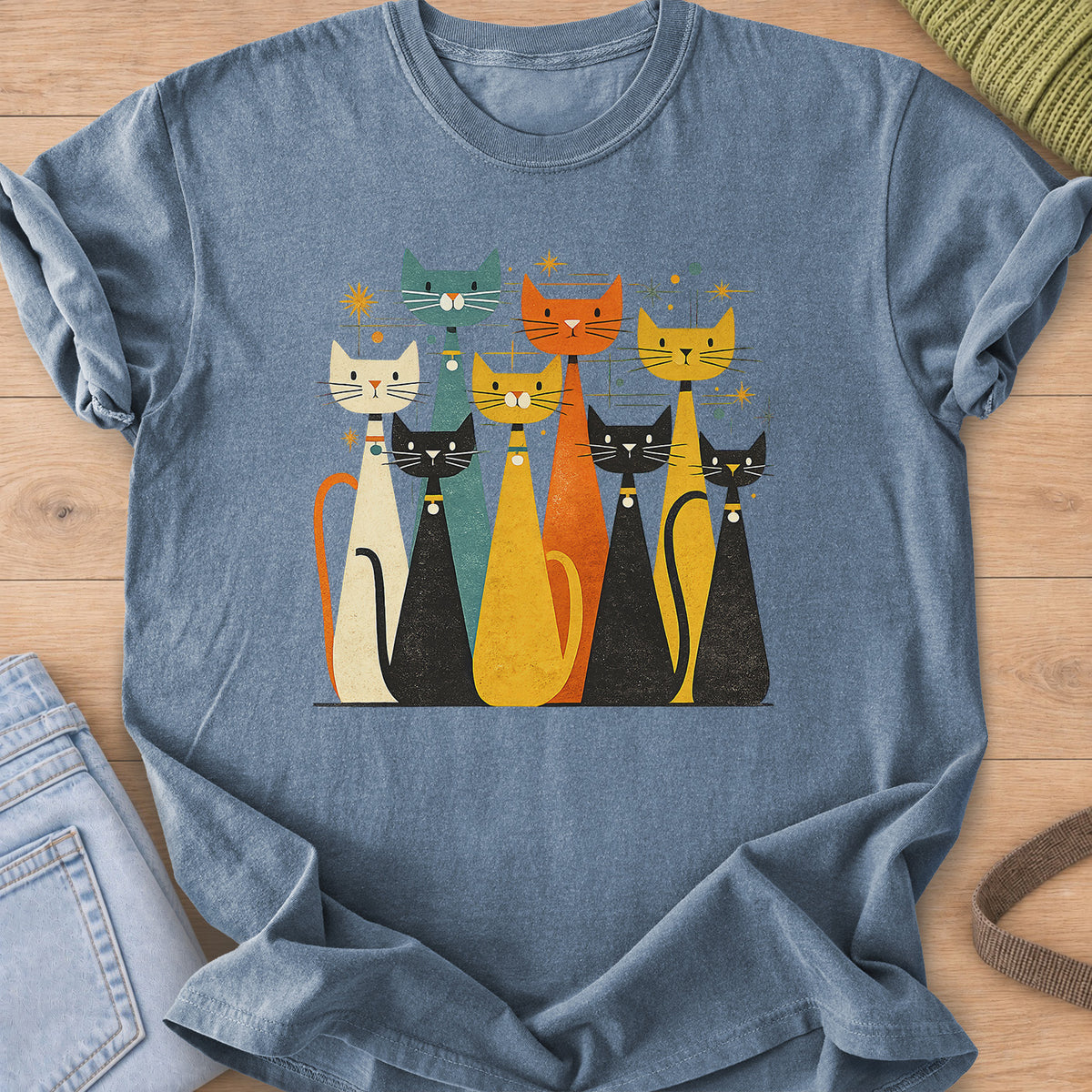 Eight tall mid-century cats with collar bells among starbursts and dots on a Blue Jean T-Shirt