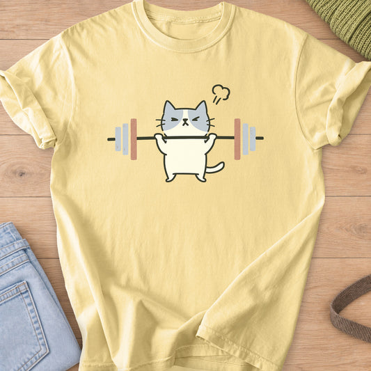 Patched cat squinting as it lifts a barbell, a puff of steam over its head on a Butter T-Shirt