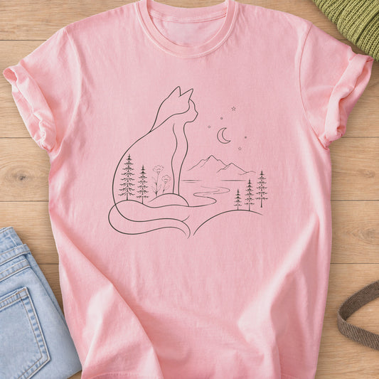 Sitting cat outline with pines and a river inside, facing mountains and a moon, dark charcoal ink on a Blossom T-Shirt