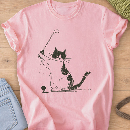 Tuxedo cat lifting a golf club into a backswing next to a ball on a tee, dark charcoal ink on a Blossom T-Shirt