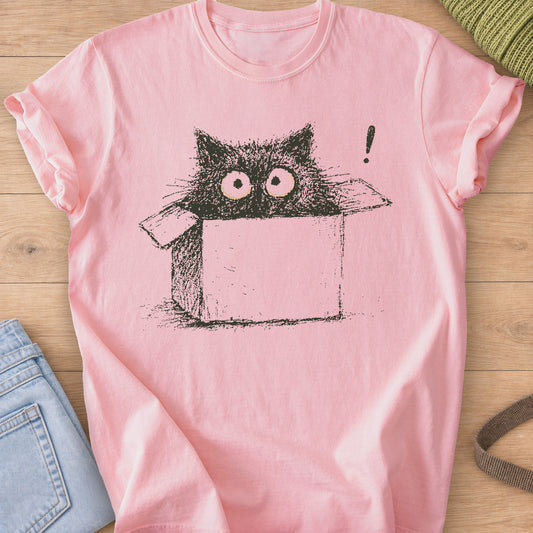Wide-eyed black cat peeking out of a cardboard box beside an exclamation mark, dark charcoal ink on a Blossom T-Shirt