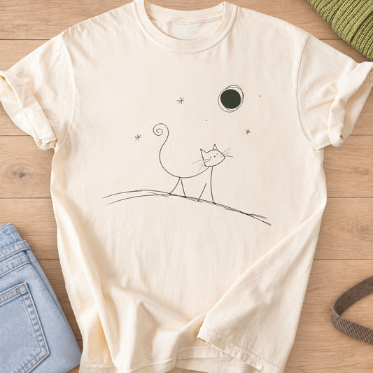 Thin doodle cat with a curly tail walking along a hill under the moon and stars, dark charcoal ink on an Ivory T-Shirt