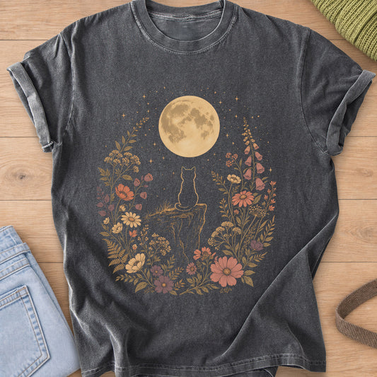 Cat seen from behind on a cliff, gazing at a full moon among wildflowers on a Pepper T-Shirt