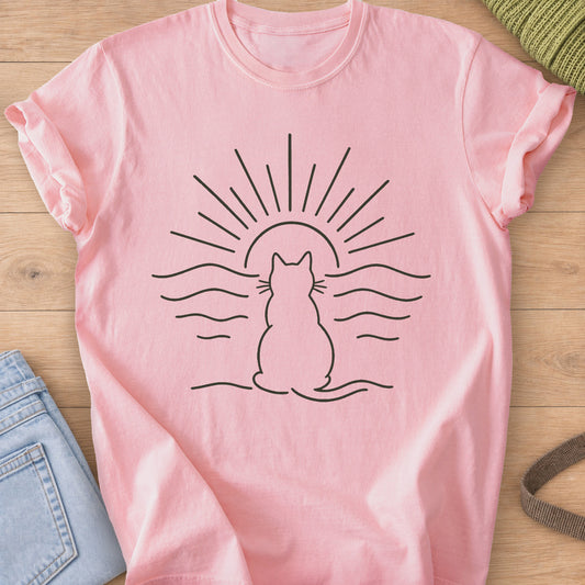 Cat outline seen from behind, watching a setting sun over rippling water, dark charcoal ink on a Blossom T-Shirt