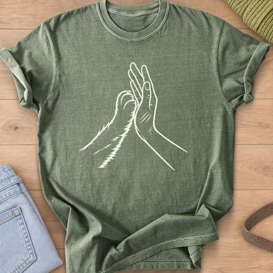 Furry cat paw and a human hand meeting in a high five, cream ink on a Moss T-Shirt