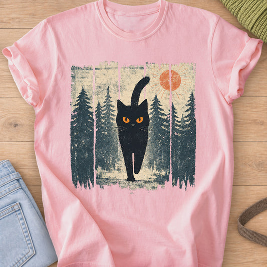 Black cat with glowing eyes walking through a pine forest beneath the sun on a Blossom T-Shirt