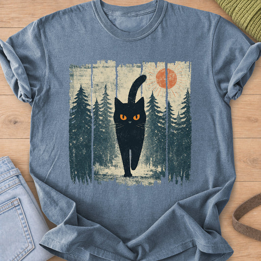 Black cat with glowing eyes walking through a pine forest beneath the sun on a Blue Jean T-Shirt