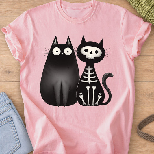 Two black cats sitting side by side, one wide-eyed and one as a skeleton, black ink on a Blossom T-Shirt