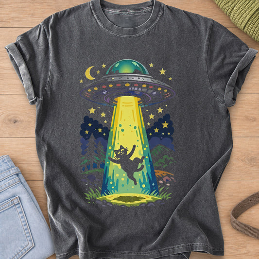 Black cat pulled up into a UFO beam under a starry sky with a moon and pine trees on a Pepper T-Shirt