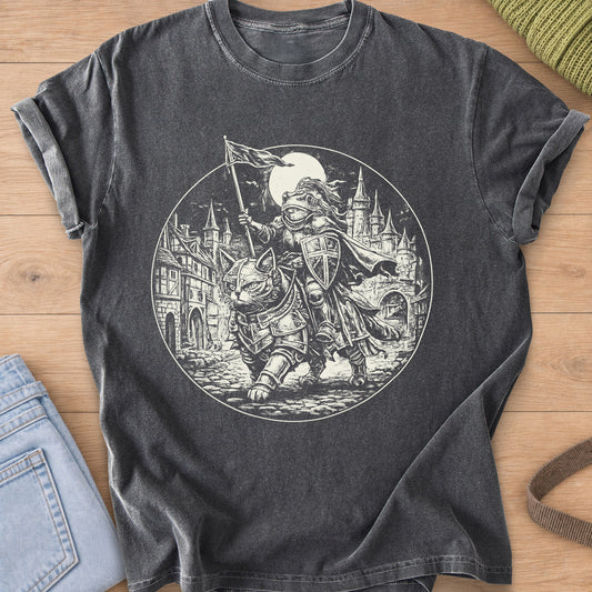 Armored cat carrying a frog knight with a flag past castle towers and a full moon, cream ink on a Pepper T-Shirt