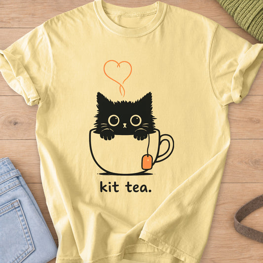 Black kitten peeking out of a teacup under a heart of steam, with "kit tea." below on a Butter T-Shirt