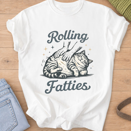 Chubby tabby cat rolled on its side under two petting hands, 'Rolling Fatties' on a White T-Shirt