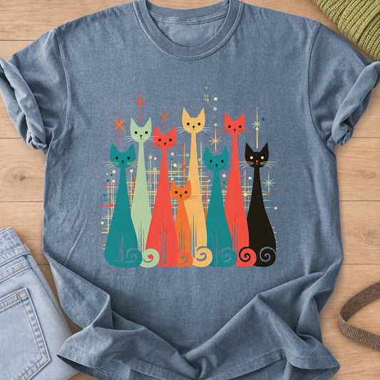 Row of eight tall slender cats with spiral tails among starbursts and dots on a Blue Jean T-Shirt