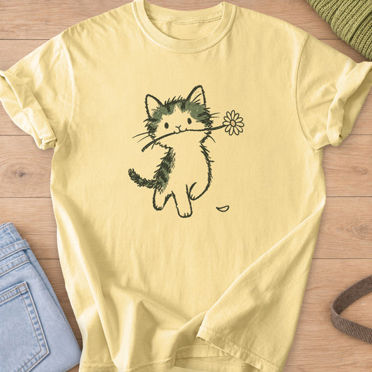 Tabby kitten walking upright with a daisy in its mouth and a fallen petal, sage and charcoal ink on a Butter T-Shirt