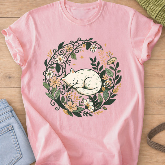 Sleeping cat curled up inside a round wreath of flowers, leaves and small stars on a Blossom T-Shirt