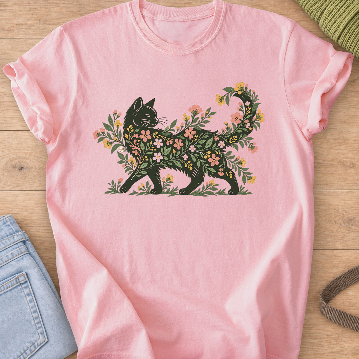 Walking cat silhouette filled with blooming flowers and leafy vines, tail curled up on a Blossom T-Shirt