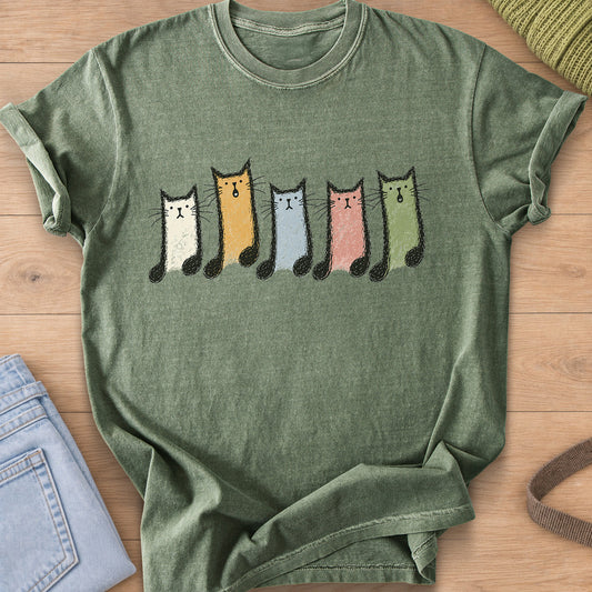 Row of five cats shaped like musical notes, some with mouths open singing on a Moss T-Shirt