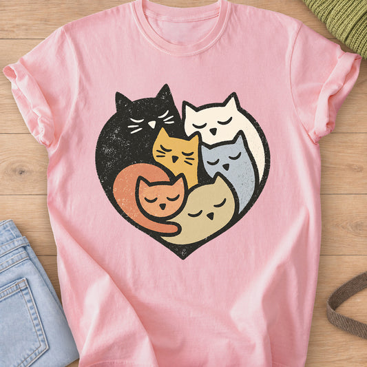 Six sleepy cats cuddled together inside a heart shape on a Blossom T-Shirt