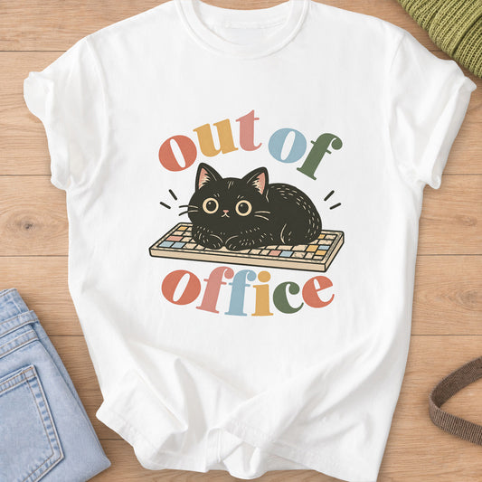 Black cat loafing on a computer keyboard, framed by the words "out of office" on a White T-Shirt