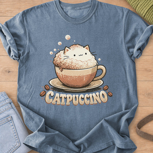 Cat peeking out of cappuccino foam in a cup on a saucer, coffee beans, "CATPUCCINO" on a Blue Jean T-Shirt