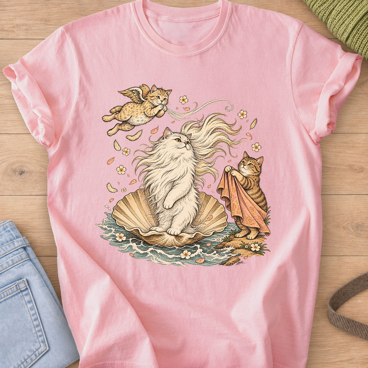 Fluffy cat on a seashell in the waves with a winged cat and a tabby holding a cloth on a Blossom T-Shirt