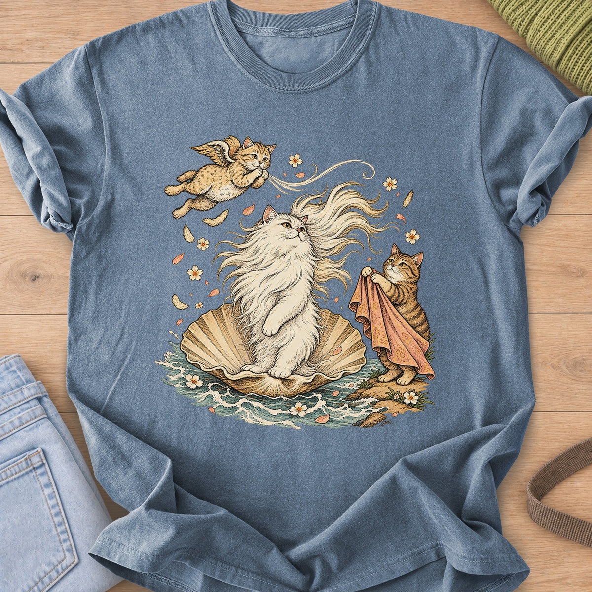 Fluffy cat on a seashell in the waves with a winged cat and a tabby holding a cloth on a Blue Jean T-Shirt