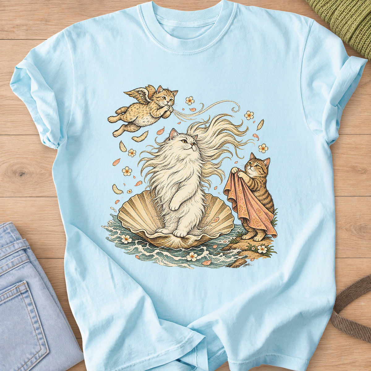 Fluffy cat on a seashell in the waves with a winged cat and a tabby holding a cloth on a Chambray T-Shirt
