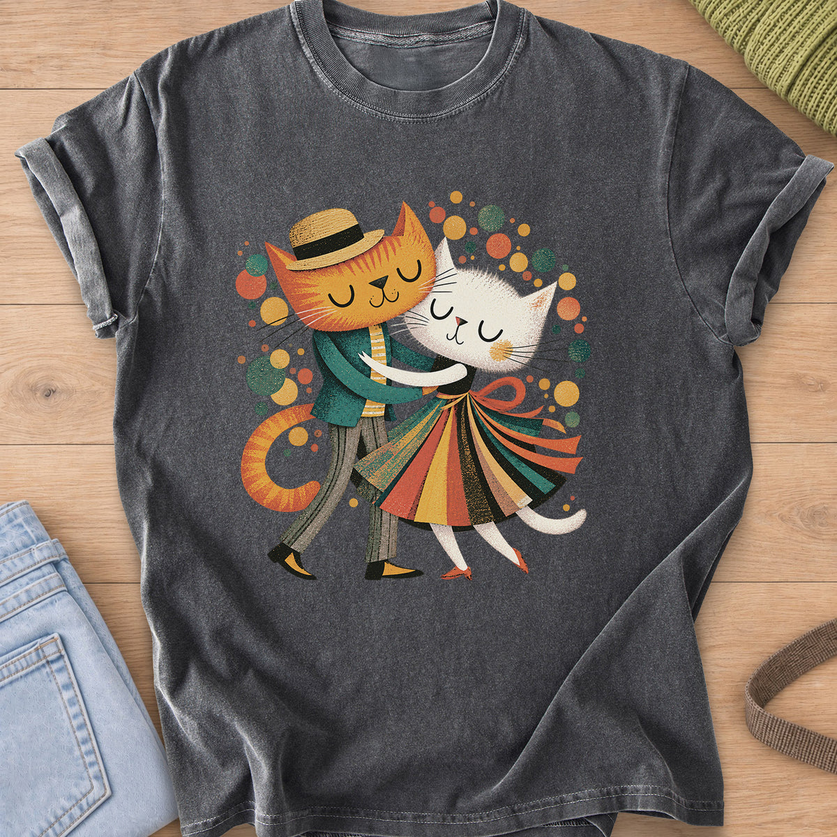 Two cats dance cheek to cheek, one in a straw hat, one in a striped skirt, amid dots on a Pepper T-Shirt