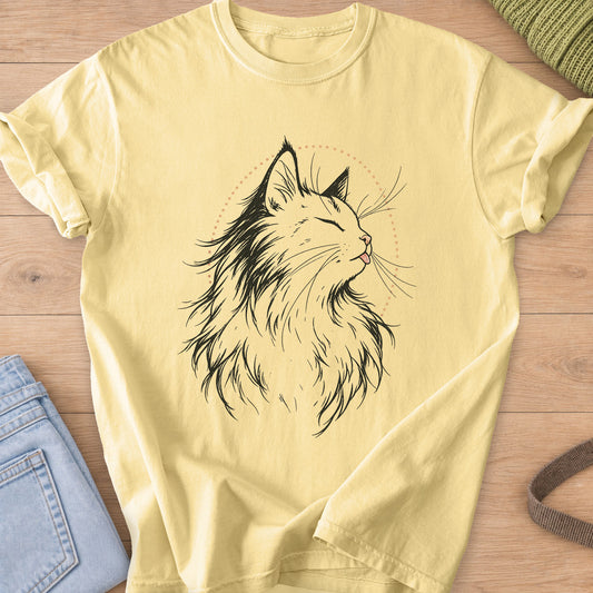 Fluffy cat, eyes closed, tiny tongue out, framed by a dotted arc, black and tan ink on a Butter T-Shirt