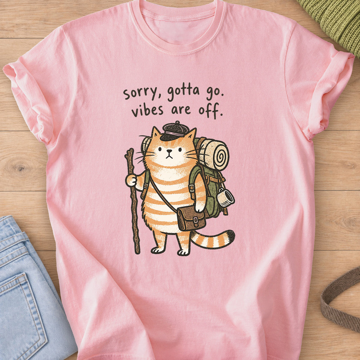 Tabby cat hiker with backpack and walking stick, "sorry, gotta go. vibes are off." on a Blossom T-Shirt
