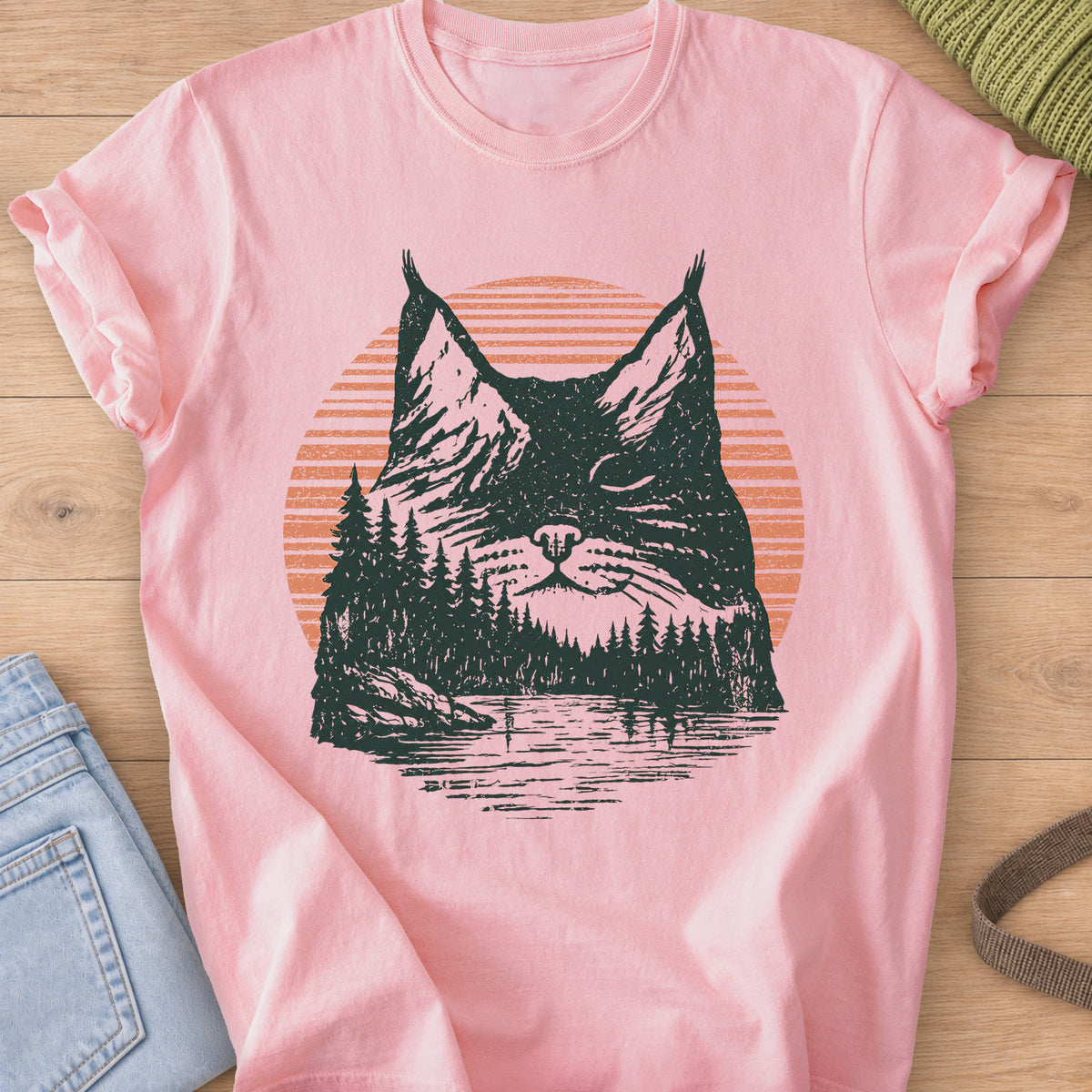 Cat face with closed eyes filled with mountains, pines, a lake and sun, dark green and coral ink on a Blossom T-Shirt