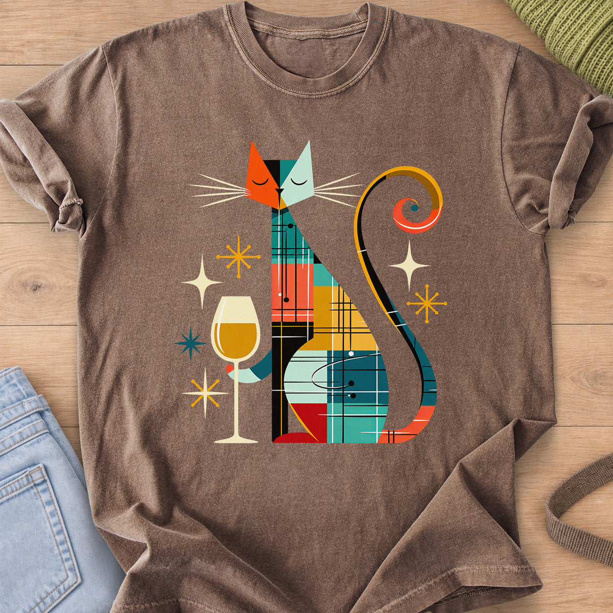 Geometric patchwork cat with closed eyes holding a wine glass among starbursts on an Espresso T-Shirt