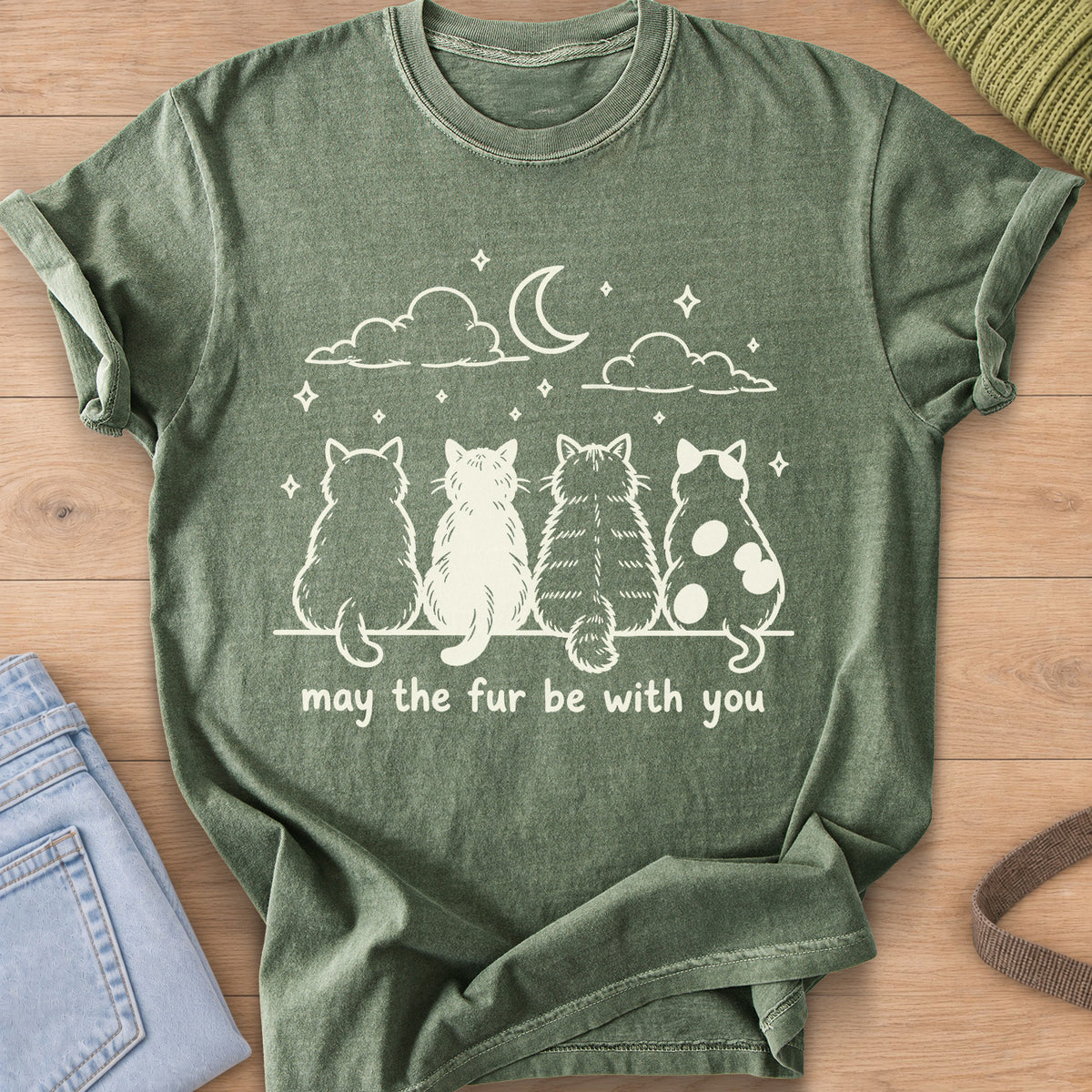 Four cats from behind gaze at a crescent moon and stars, "may the fur be with you", cream ink on a Moss T-Shirt