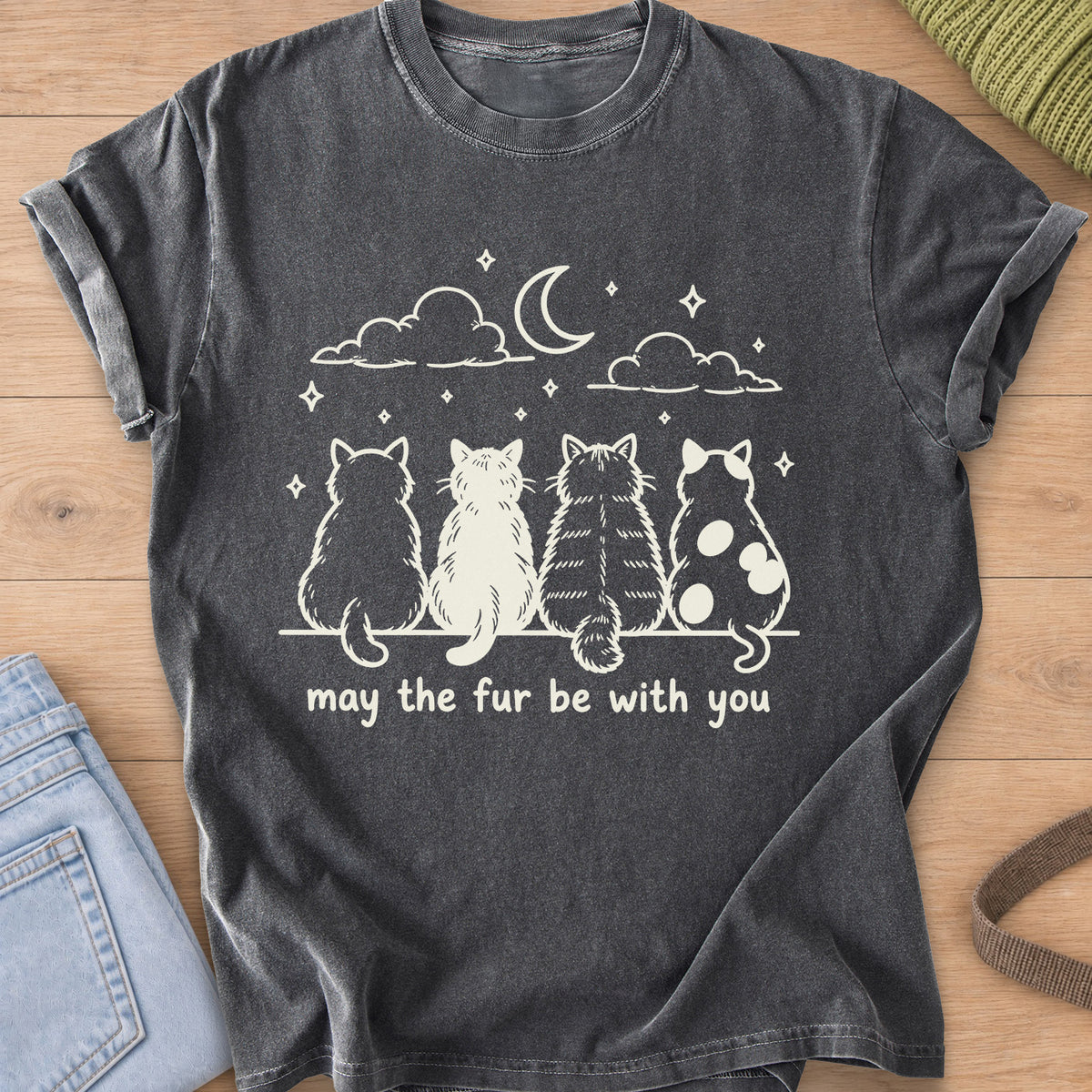 Four cats from behind gaze at a crescent moon and stars, "may the fur be with you", cream ink on a Pepper T-Shirt